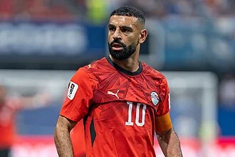 Mohamed Salah in the Liverpool kit — the Premier League's financial leader with an estimated $150–180 million net worth