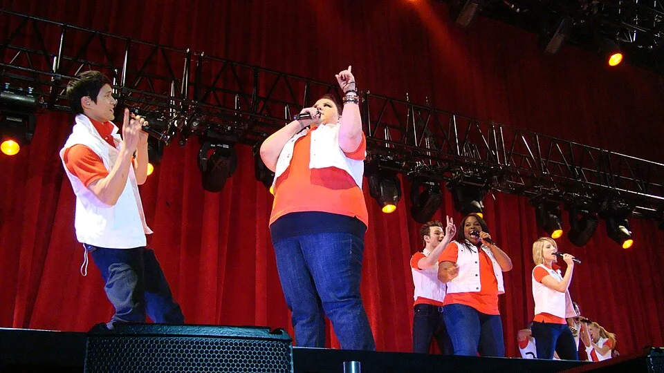 Harry Shum Jr. performing with the Glee cast on the Glee Live concert tour