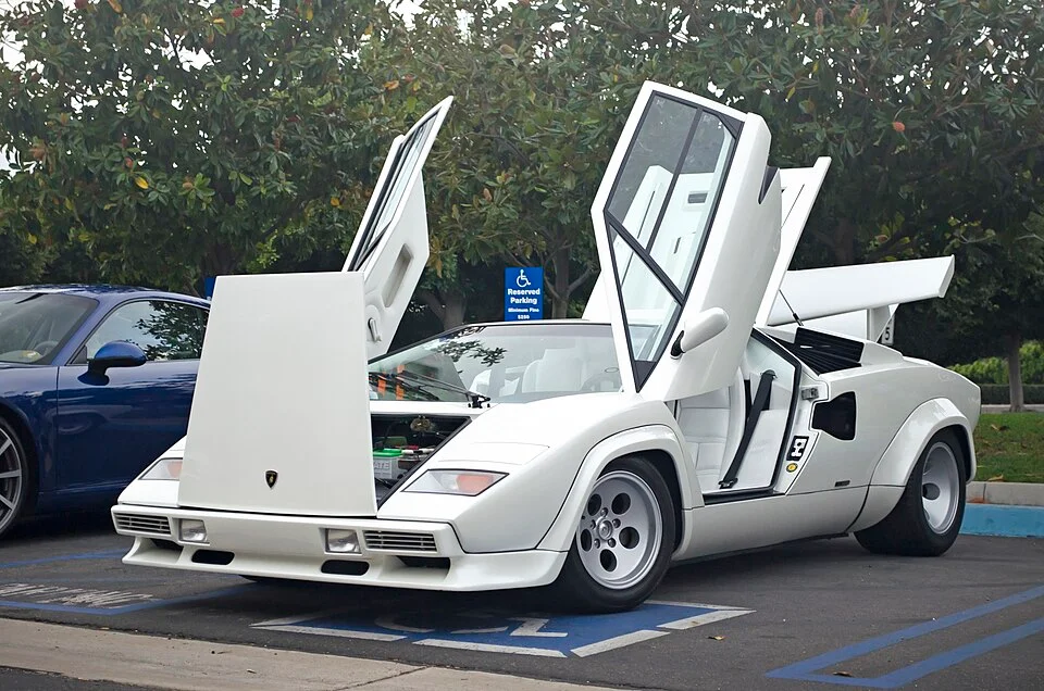 White Lamborghini Countach with scissor doors open like in Wolf of Wall Street