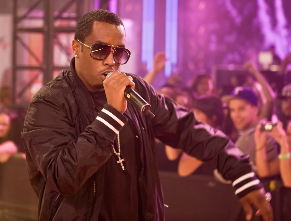 Sean Diddy Combs live performance with sunglasses and microphone at concert venue