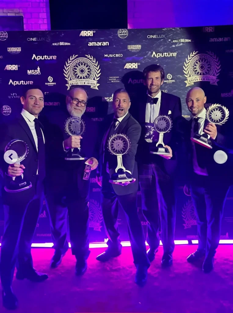 Jason Cammisa holding an automotive journalism award for his Biography Diary 2026 profile.