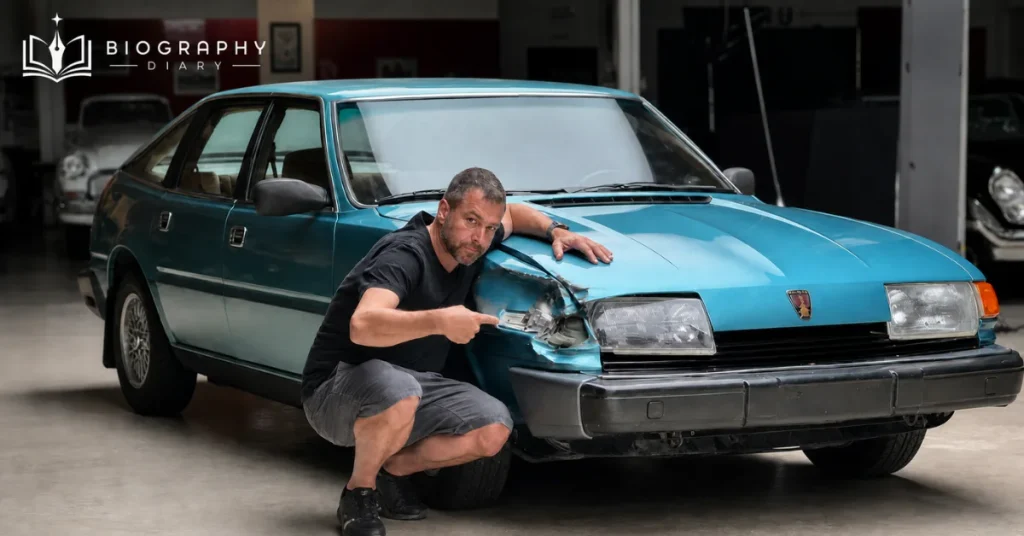 Jason Cammisa with his 1980 Rover 3500 V8 showing the front-end damage from a cross-country crash while driving to Los Angeles for a Jay Leno's Garage taping. True to form, he documented the ordeal rather than hiding it.