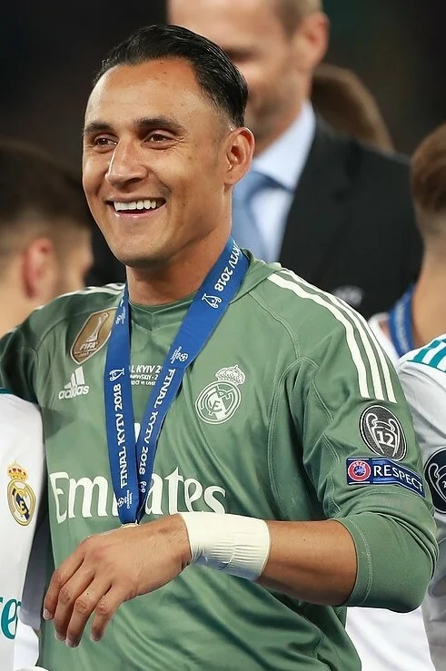 Keylor Navas smiling with his Champions League winners medal after the 2018 final in Kyiv