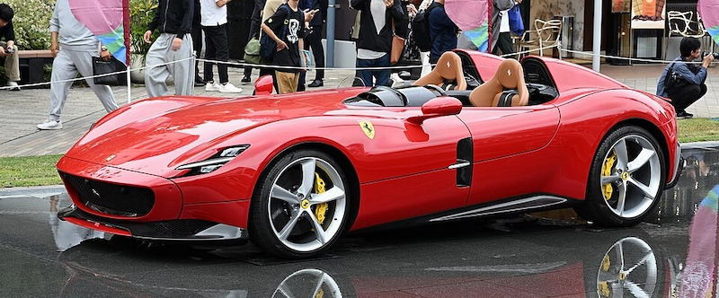 Red Ferrari Monza SP2 speedster — one of the cars consistently listed in Max Verstappen's reported collection
