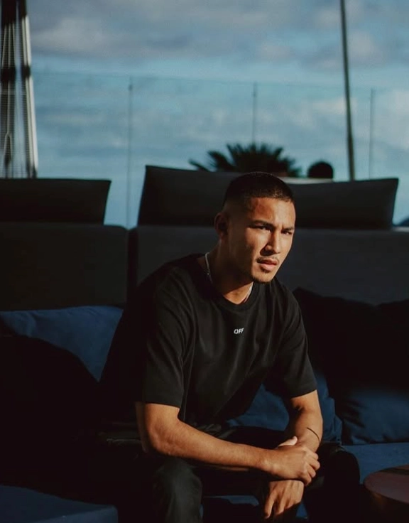 Faiq Bolkiah in a candid off-pitch moment on a rooftop lounge
