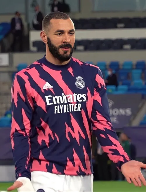 Karim Benzema in a Real Madrid training top during a warm-up