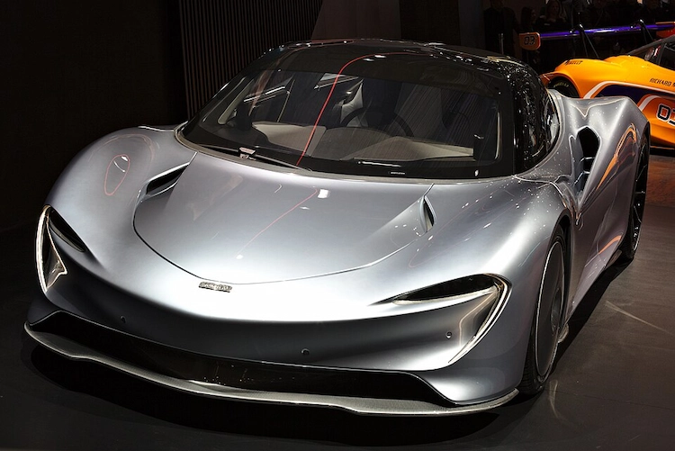 Silver McLaren Speedtail three-seat hyper-GT on display at a motor show