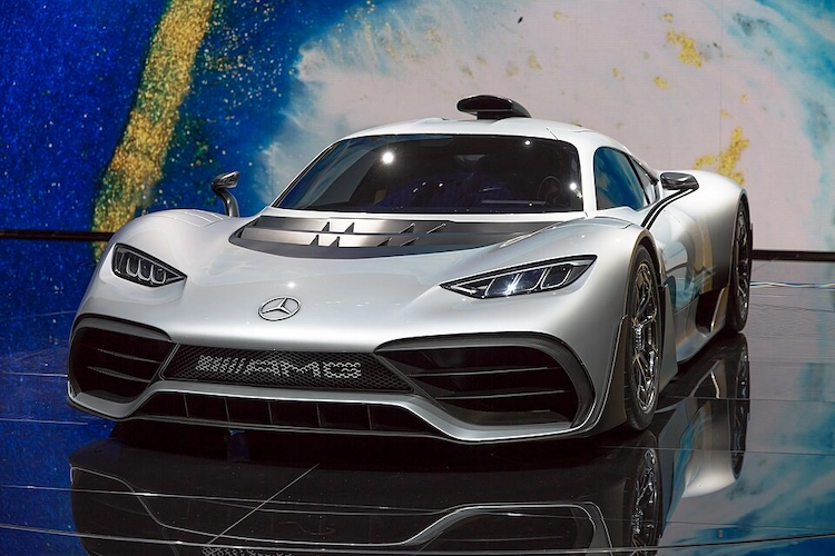 Silver Mercedes-AMG One hypercar on display at a motor show