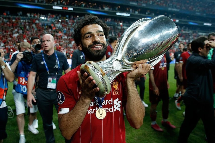 Mohamed Salah celebrating with the UEFA Super Cup trophy after Liverpool's 2019 win in Istanbul