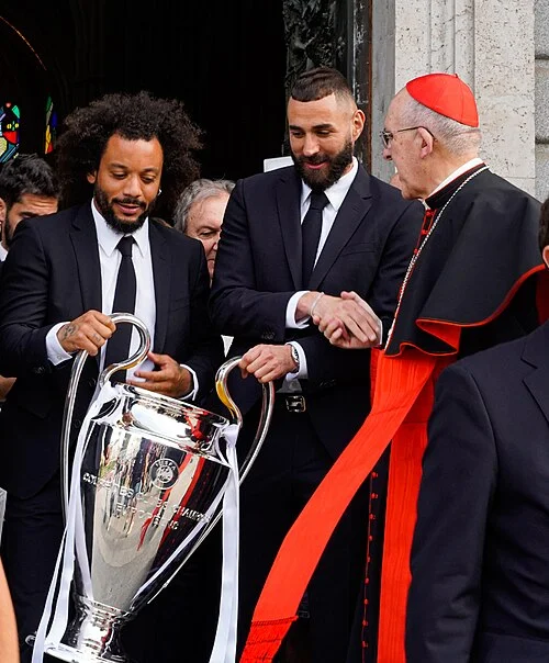 Karim Benzema and Marcelo with the Champions League trophy at Madrid's cathedral