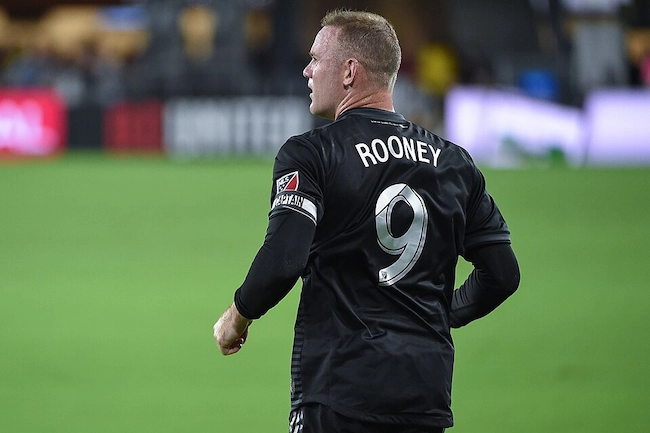 Wayne Rooney from behind wearing his black D.C. United captain's jersey with number 9