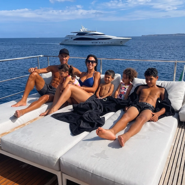Cristiano Ronaldo, Georgina Rodríguez and their children relaxing on the sun deck of their yacht in the Mediterranean