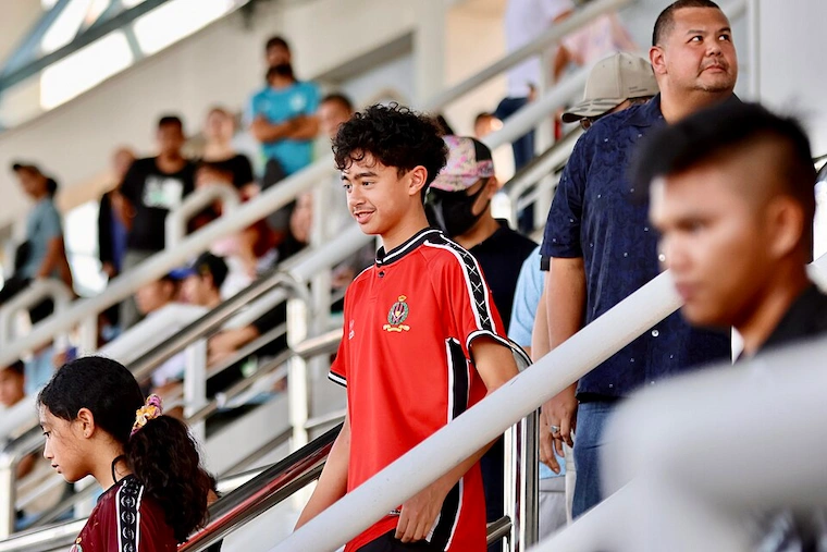 Prince Abdul Hakeem of Brunei (right, in navy shirt) attending the DPMM FC vs Kasuka FC football match with other members of the royal family, December 2022