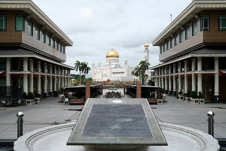 The Yayasan Sultan Haji Hassanal Bolkiah complex in Bandar Seri Begawan, Brunei, with the gold-domed Sultan Omar Ali Saifuddien Mosque in the background, January 2026