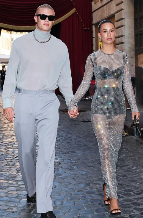 Erling Haaland and Isabel Haugseng Johansen holding hands at a public event