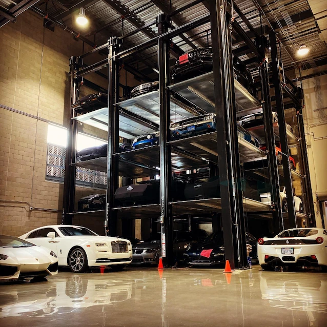 Inside Westside Collector Car Storage in Playa Vista showing multi-level stacking lifts for luxury vehicles